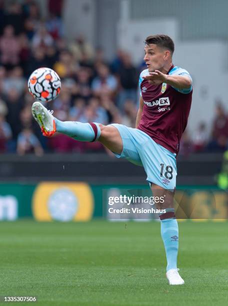 Ashley Westwood of Burnley in action during the Premier League match between Burnley and Brighton & Hove Albion at Turf Moor on August 14, 2021 in...