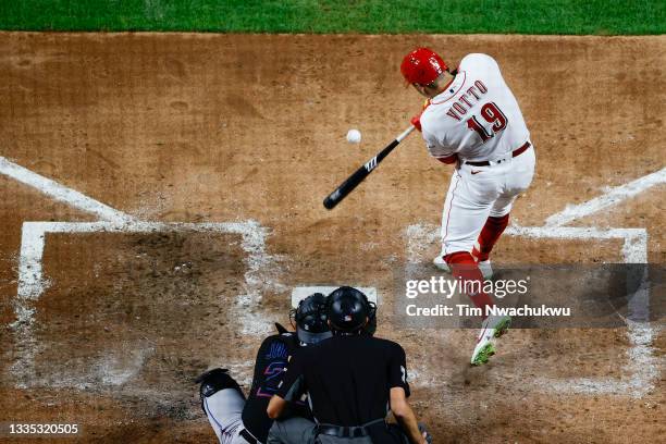 Joey Votto of the Cincinnati Reds hits a one run home run during the fifth inning against the Miami Marlins at Great American Ball Park on August 20,...