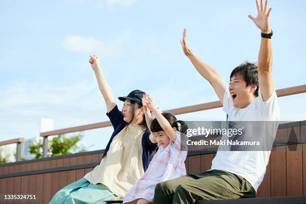 family cheering for friends in audience - hyper japan stock pictures, royalty-free photos & images