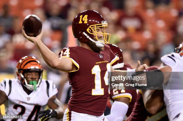 Ryan Fitzpatrick of the Washington Football Team throws a pass against the Cincinnati Bengals during the NFL preseason game at FedExField on August...