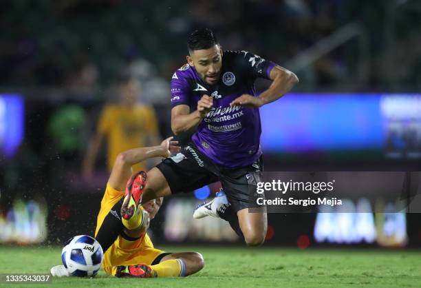 Jorge Padilla of Mazatlan and Jesus Dueñas of Tigres fight for the ball during the 6th round match between Mazatlan FC and Tigres UANL as part of the...