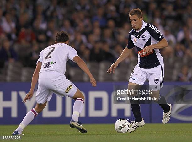 Daniel Allsopp of the Victory contests with Josh Mitchell of the Glory during the round seven A-League match between the Melbourne Victory and the...