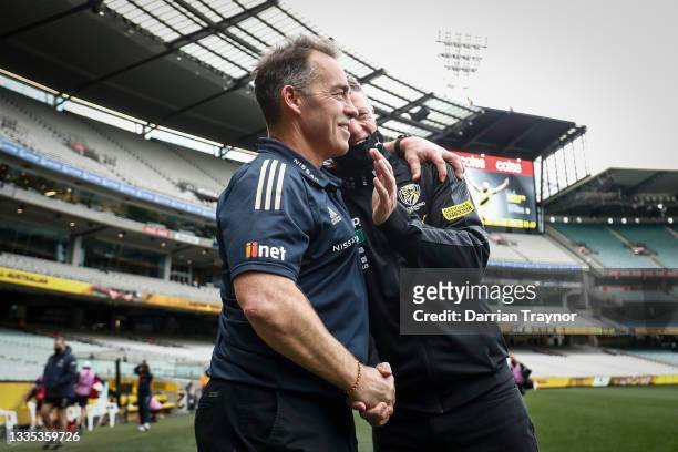 Hawthorn Senior coach Alastair Clarkson and Richmond senior coach, Damien Hardwick embrace after the round 23 AFL match between Richmond Tigers and...
