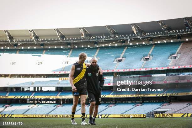 David Astbury and Bachar Houli of the Tigers take one last walk on the M.C.G. As Richmond player after the round 23 AFL match between Richmond Tigers...