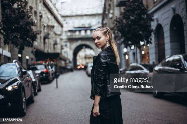 beautiful young blonde woman on an old street - elegance is an attitude ストックフォトと画像