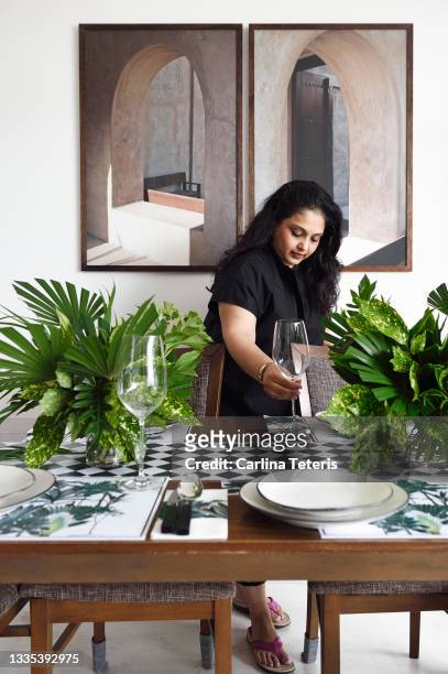 woman setting a formal dining table - event planning stock pictures, royalty-free photos & images