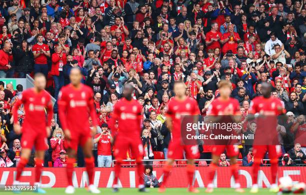 Fans of Liverpool take part in a minutes applause in remembrance of Andrew Devine, the 97th victim of the Hillsborough Stadium disaster prior to the...