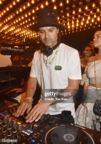 Street Artist Alec Monopoly aka Alec Andon performs during the Alec Monopoly X Belart After Party at VIP Room Saint Tropez on August 20, 2021 in...