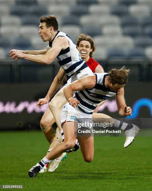 Jeremy Cameron of the Cats and Lachie Henderson of the Cats collide during the round 23 AFL match between Geelong Cats and Melbourne Demons at GMHBA...