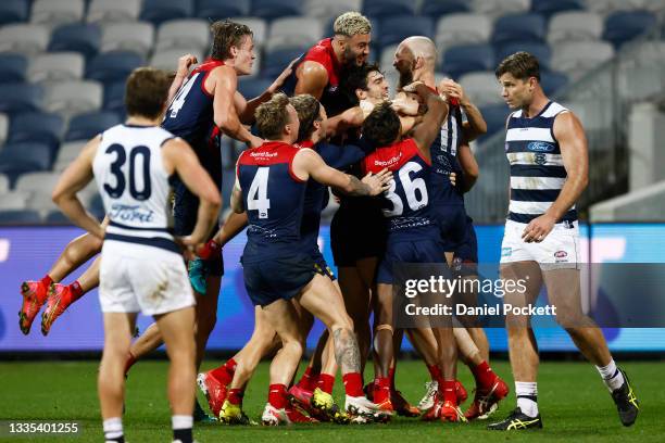 The Demons celebrate a goal to Max Gawn of the Demons after the siren to win the round 23 AFL match between Geelong Cats and Melbourne Demons at...