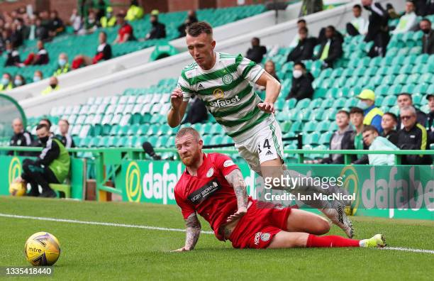 David Turnbull of Celtic is fouled by Alan Power of St Mirren which leads to a red card being shown during the Cinch Scottish Premiership match...