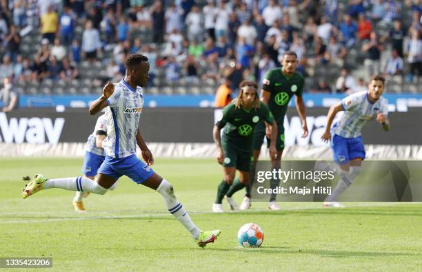 Dodi Lukebakio of Hertha Berlin scores their side's first goal from the penalty spot during the Bundesliga match between Hertha BSC and VfL Wolfsburg...