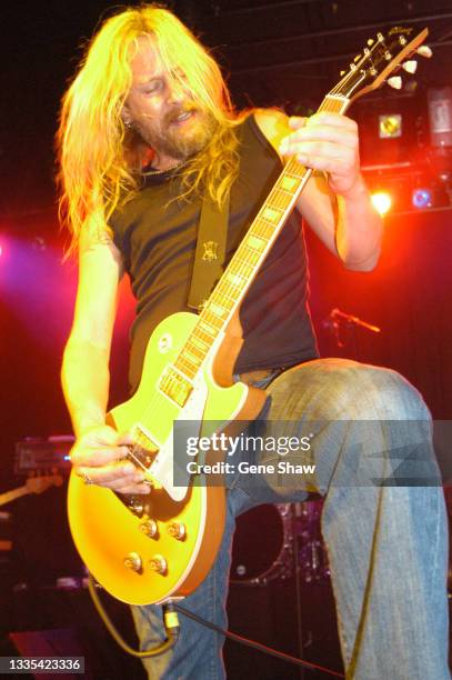 American Rock musician Jerry Cantrell plays guitar as he performs on stage during a DKNY/Vanity Fair benefit concert at Irving Plaza, New York, New...