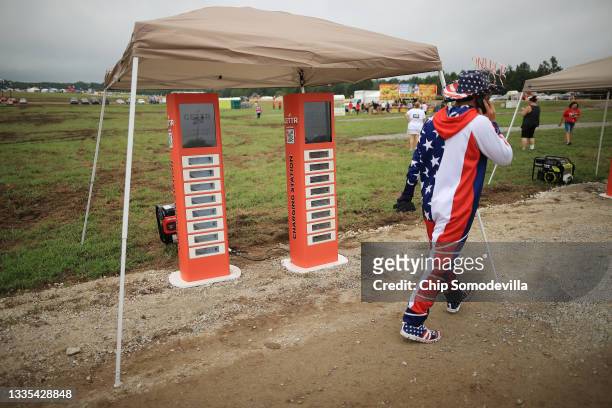 Free mobile charging stations are provided by GETTR for supporters of former U.S. President Donald Trump outside a "Save America" rally at York...