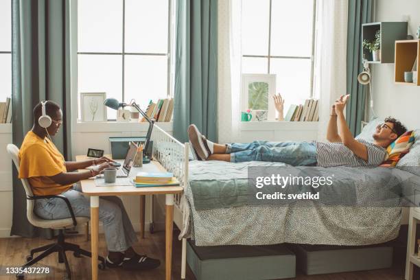 friends at college dorm room - college dorm stock pictures, royalty-free photos & images