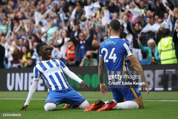 Shane Duffy of Brighton and Hove Albion celebrates with teammate Yves Bissouma after scoring their side's first goal during the Premier League match...