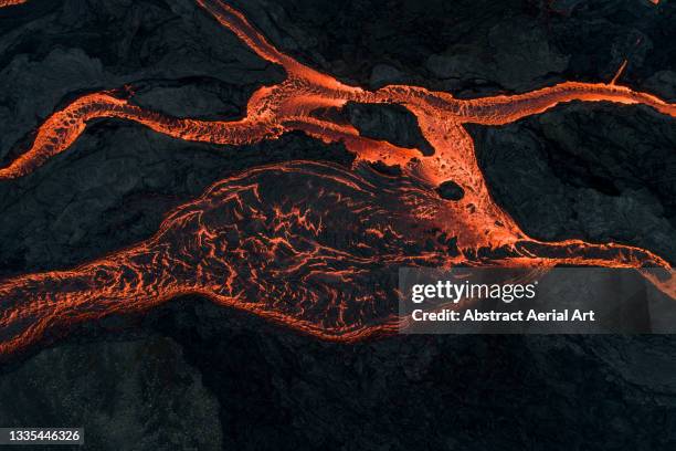 drone perspective showing lava flowing from fagradalsfjall volcano, reykjanes peninsula, iceland - active fault stock pictures, royalty-free photos & images
