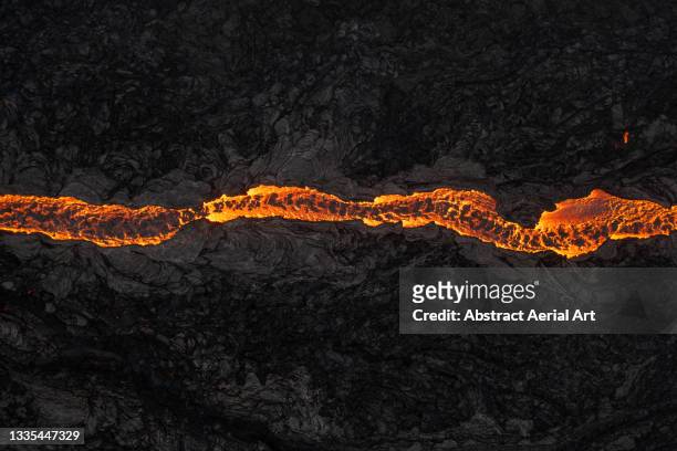 winding lava flow from fagradalsfjall volcano photographed by drone reykjanes peninsula, iceland - volcanic landscape stock pictures, royalty-free photos & images