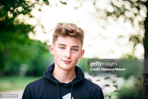 teenage boy outdoors looking at camera - boy face happy stock pictures, royalty-free photos & images