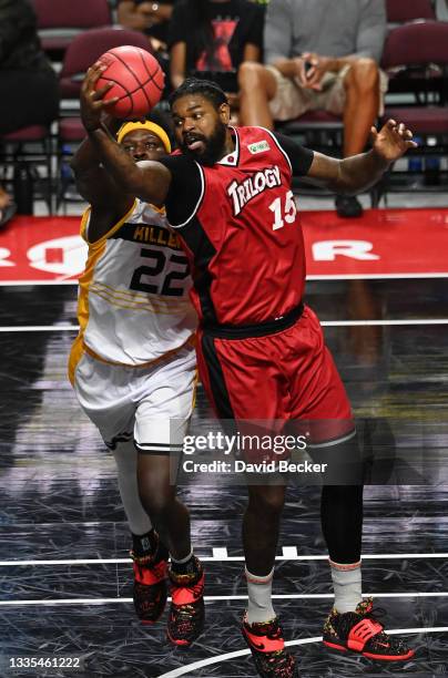 Mo Charlo of Killer 3's and Amir Johnson of Trilogy go after a rebound during a BIG3 game in Week Eight at the Orleans Arena on August 21, 2021 in...