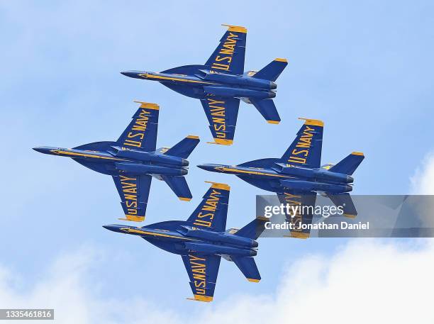 The Blue Angels fly over Soldier Field during a performance at the Chicago Air and Water Show during a preseason game between the Chicago bears and...