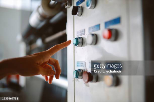 close up on the female hand pushing the button - electrical switch stock pictures, royalty-free photos & images
