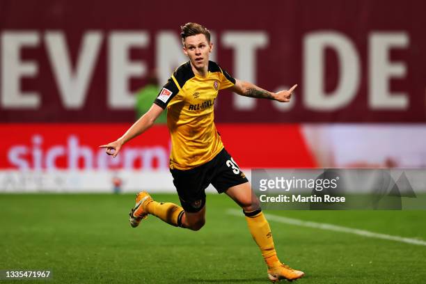 Julius Kade of Dynamo Dresden celebrates scoring his sides third goal during the Second Bundesliga match between FC Hansa Rostock and SG Dynamo...