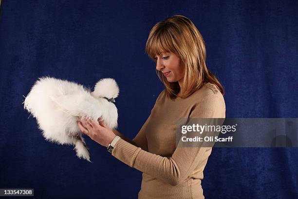 Louise Hidden, from Derbyshire, holds her 6 month old White Silkie Pullet which won a 2nd prize in its breed at the Poultry Club's 2011 National Show...