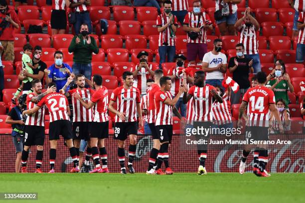 Inigo Martinez of Athletic Bilbao celebrates with his team after scoring the opening goal during the LaLiga Santander match between Athletic Club and...