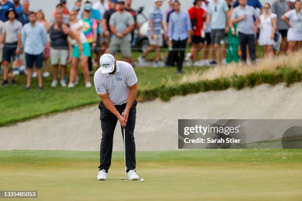 Jon Rahm of Spain putts on the 18th green during the third round of THE NORTHERN TRUST, the first event of the FedExCup Playoffs, at Liberty National...