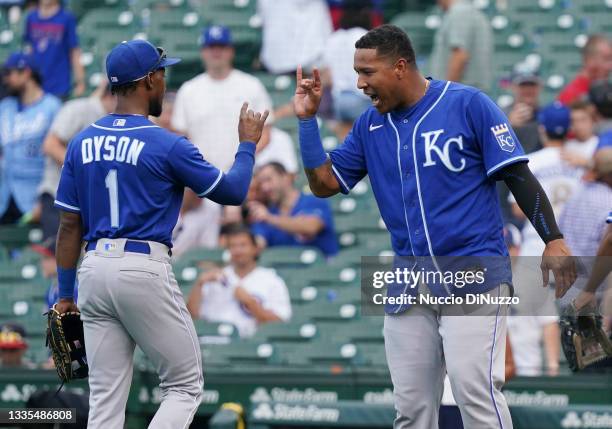 Jarrod Dyson and Salvador Perez of the Kansas City Royals celebrate their team win over the Chicago Cubs at Wrigley Field on August 21, 2021 in...