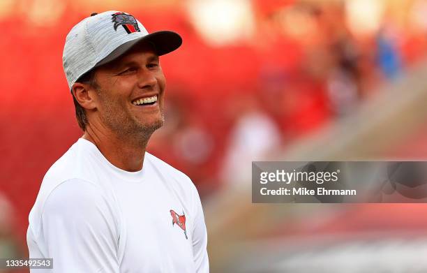 Tom Brady of the Tampa Bay Buccaneers looks on during a preseason game against the Tennessee Titans at Raymond James Stadium on August 21, 2021 in...