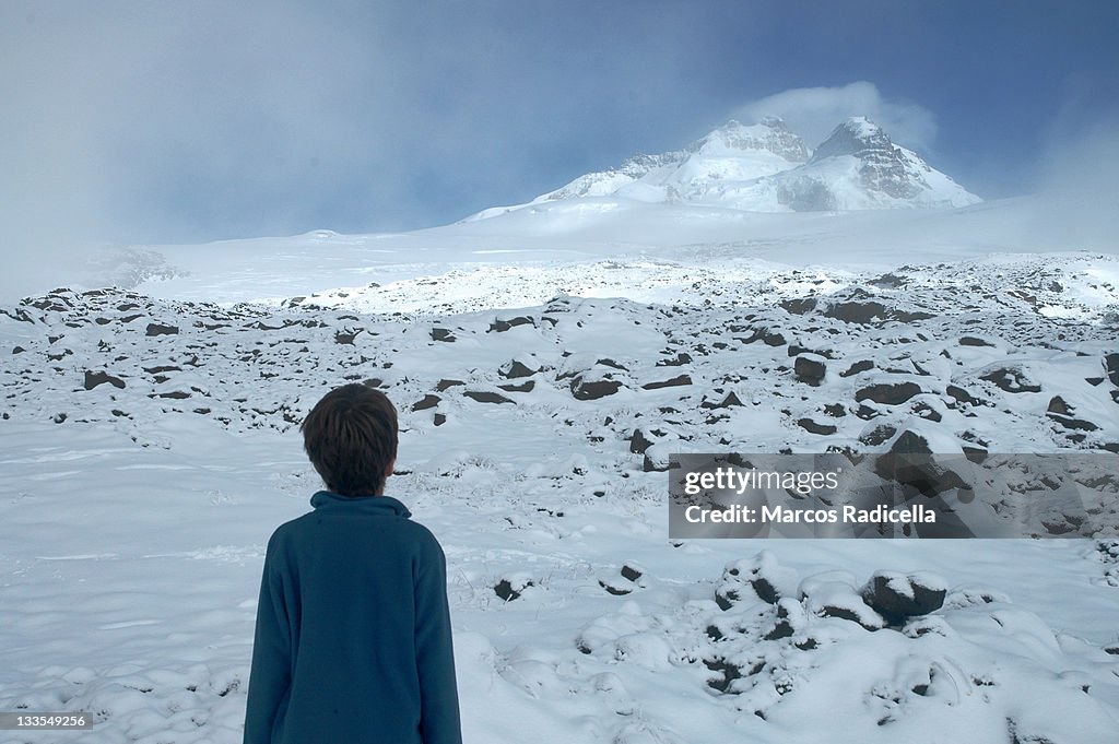 Boy staring at Tronador mount, Patagonia Argentina