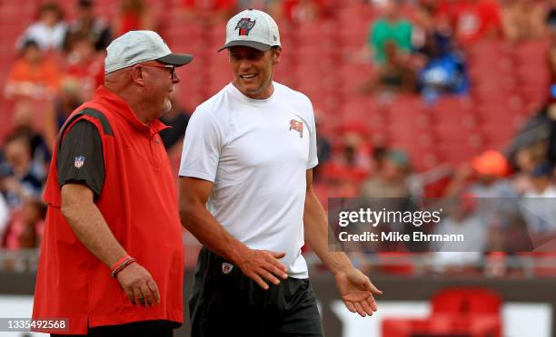 Head coach Bruce Arians and Tom Brady of the Tampa Bay Buccaneers talk during a preseason game against the Tennessee Titans at Raymond James Stadium...