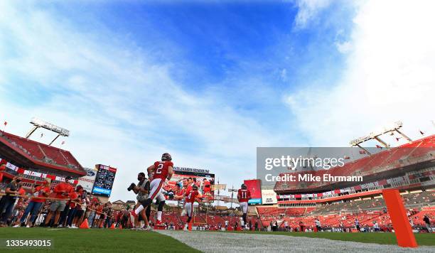 Kyle Trask of the Tampa Bay Buccaneers warms up during a preseason game against the Tennessee Titans at Raymond James Stadium on August 21, 2021 in...