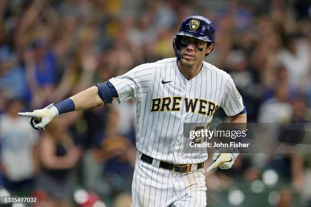 Christian Yelich of the Milwaukee Brewers points to the Brewers dugout after hitting a grand slam in the eighth inning against the Washington...