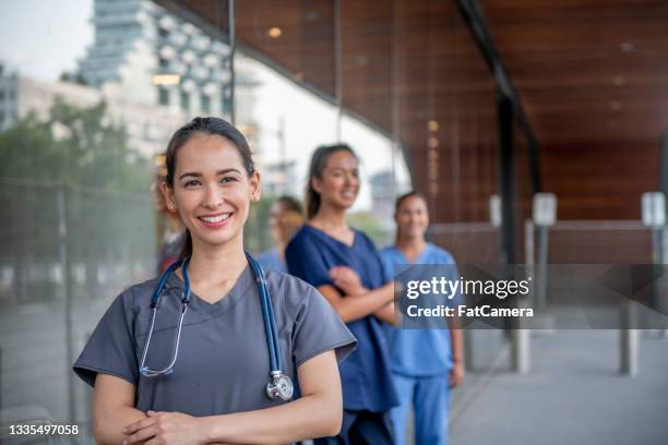 young mixed race female medical student - female nurse stockfoto's en -beelden