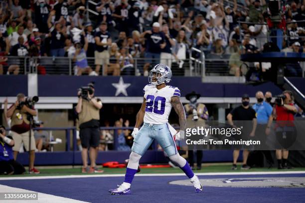 Running back Tony Pollard of the Dallas Cowboys celebrates after scoring a touchdown against the Houston Texans in the first quarter at AT&T Stadium...