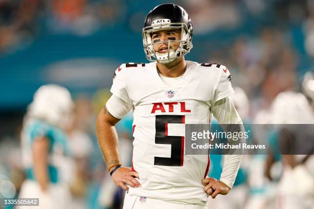 McCarron of the Atlanta Falcons reacts after being injured during a preseason game against the Miami Dolphins at Hard Rock Stadium on August 21, 2021...
