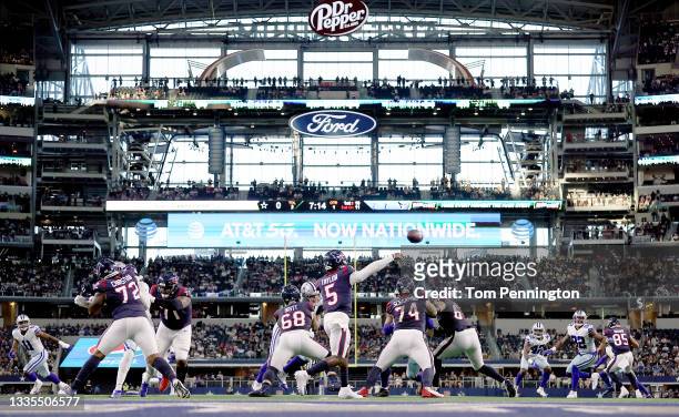 Quarterback Tyrod Taylor of the Houston Texans passes the ball to an open receiver against the Dallas Cowboys in the first quarter of a preseason NFL...