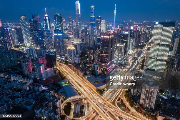 aerial view of urban skyline with overpass at night - guangzhou stock pictures, royalty-free photos & images