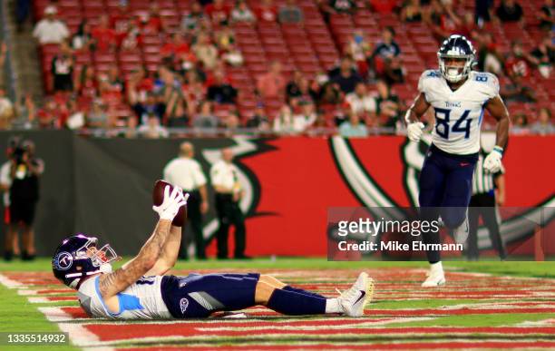 Mason Kinsey of the Tennessee Titans celebrates a touchdown during a preseason game against the Tampa Bay Buccaneers at Raymond James Stadium on...