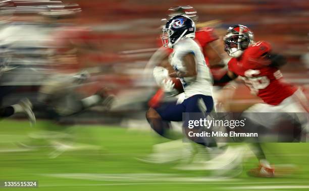 Cameron Batson of the Tennessee Titans returns a kick during a preseason game against the Tampa Bay Buccaneers at Raymond James Stadium on August 21,...