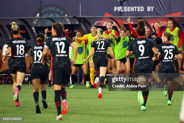 Morgan Weaver of Portland Thorns FC celebrates with teammates after scoring the game-winning goal in the 87th minute during the 2021 Women's...