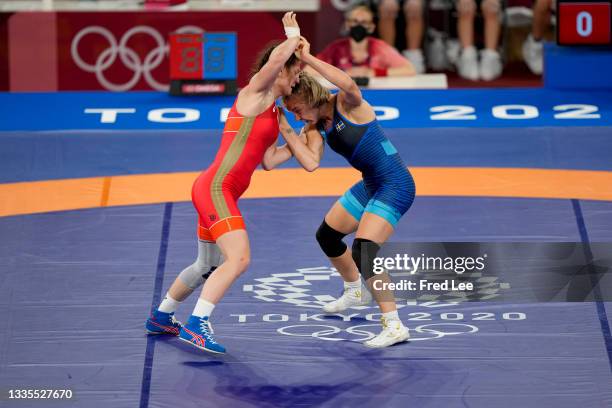 Liubov Ovcharova of ROC competes Henna Katarina Johansson of Team Sweden during the Women's Freestyle 62kg Repechage on day twelve of the Tokyo 2020...