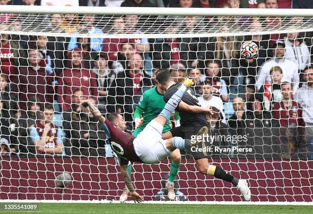 Danny Ings of Aston Villa scores their side's first goal from an overhead kick during the Premier League match between Aston Villa and Newcastle...