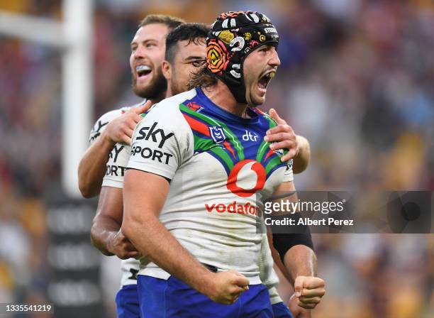 Josh Curran of the Warriors celebrates scoring a try during the round 23 NRL match between the Brisbane Broncos and the New Zealand Warriors at...