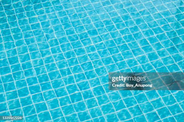 abstract view of bottom caustics of swimming pool with ripple and flow on water surface. - water ripple stock-fotos und bilder
