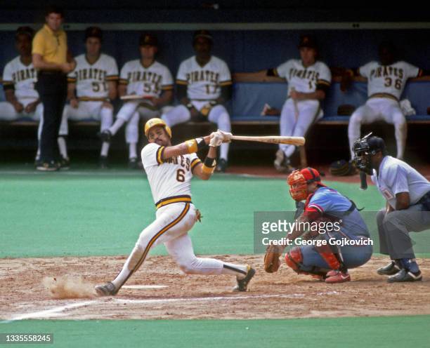 Tony Pena of the Pittsburgh Pirates bats as catcher Darrell Porter of the St. Louis Cardinals and umpire Charlie Williams look on during a Major...
