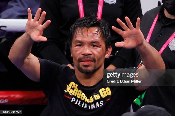 Manny Pacquiao gestures to fans after his WBA welterweight title fight against Yordenis Ugas at T-Mobile Arena on August 21, 2021 in Las Vegas,...